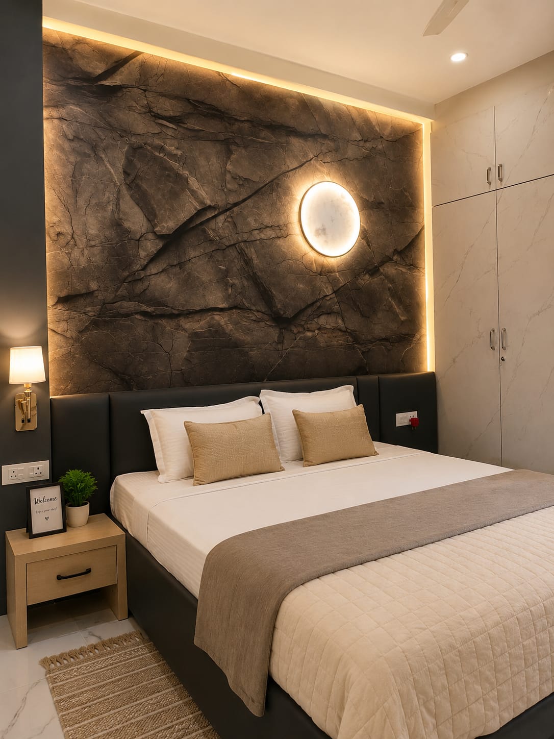 Bedroom with dramatic stone accent wall and moon lamp
