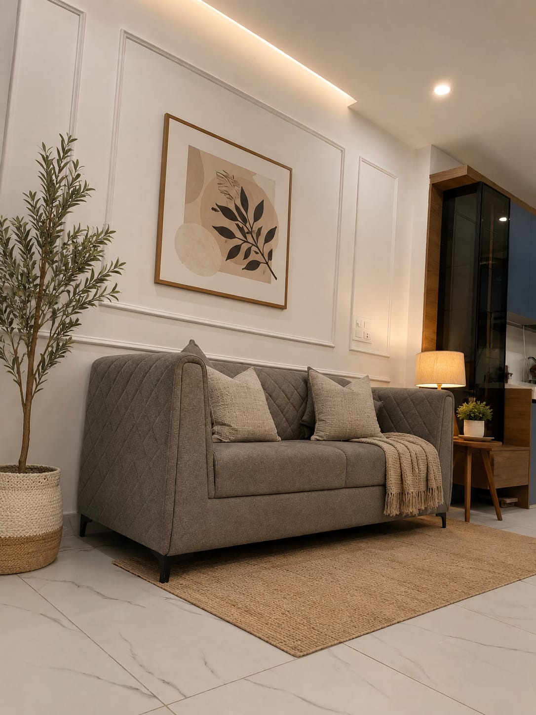 Living lounge with grey loveseat and panelled wall